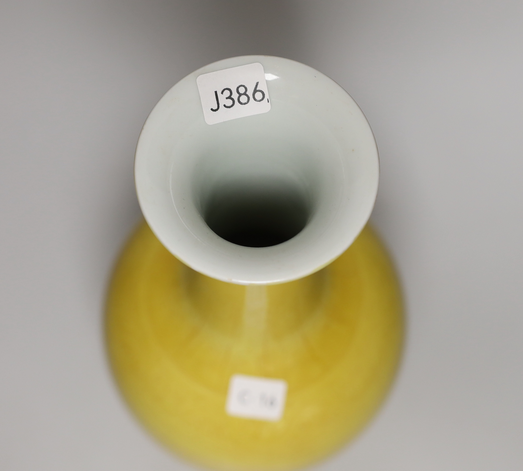 A Chinese yellow ground vase with incised detail, 30cm